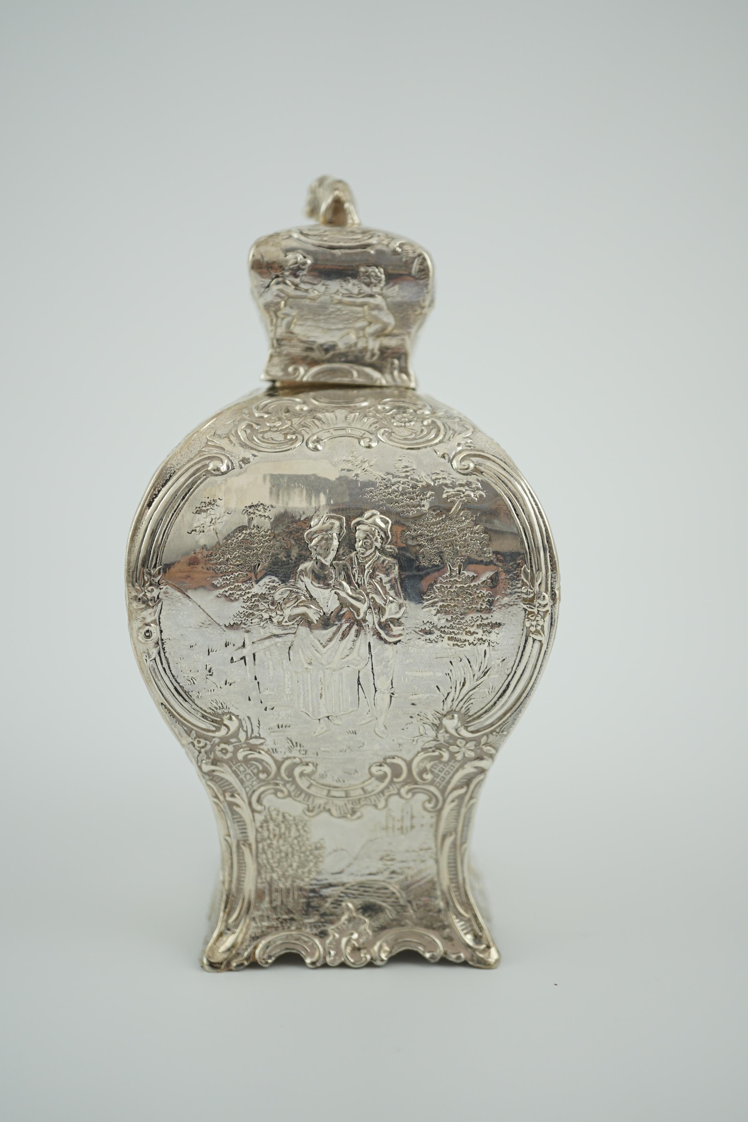 A late 19th century Hanau embossed silver bombé shaped tea caddy and cover